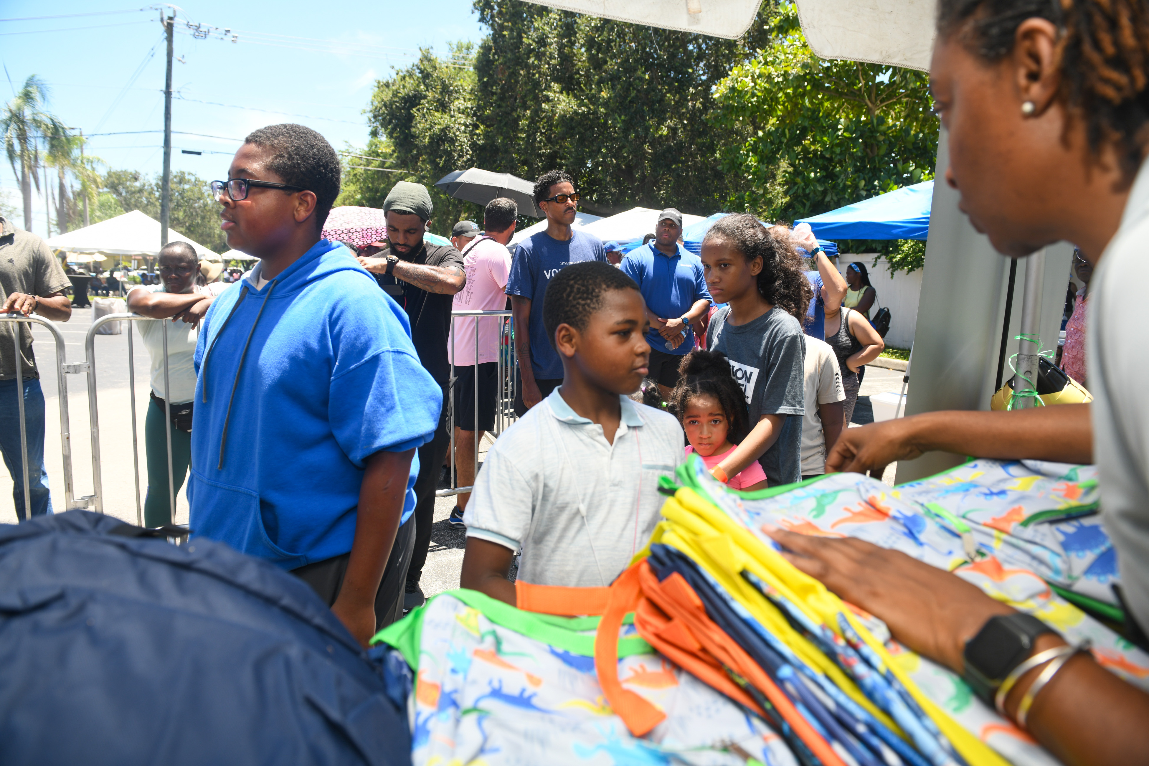 Community members receiving supplies at a family support event